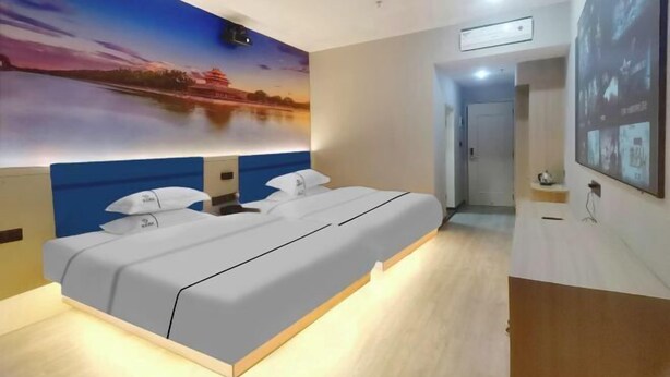 A modern hotel room with a large bed, a painting of a sunset over a body of water, and a hallway leading to a bathroom. - Yaduo Hotel (Xinfeng County Yunjishan Scenic Area) (Xinfeng)