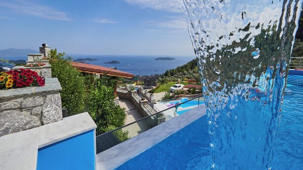 A pool with a clear view of the sea and distant islands. - Villa Noa Exclusive 4 Bedrooms (Skiathos)