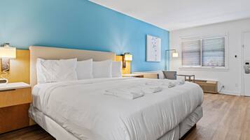 Desk, laptop workspace, blackout drapes, iron/ironing board