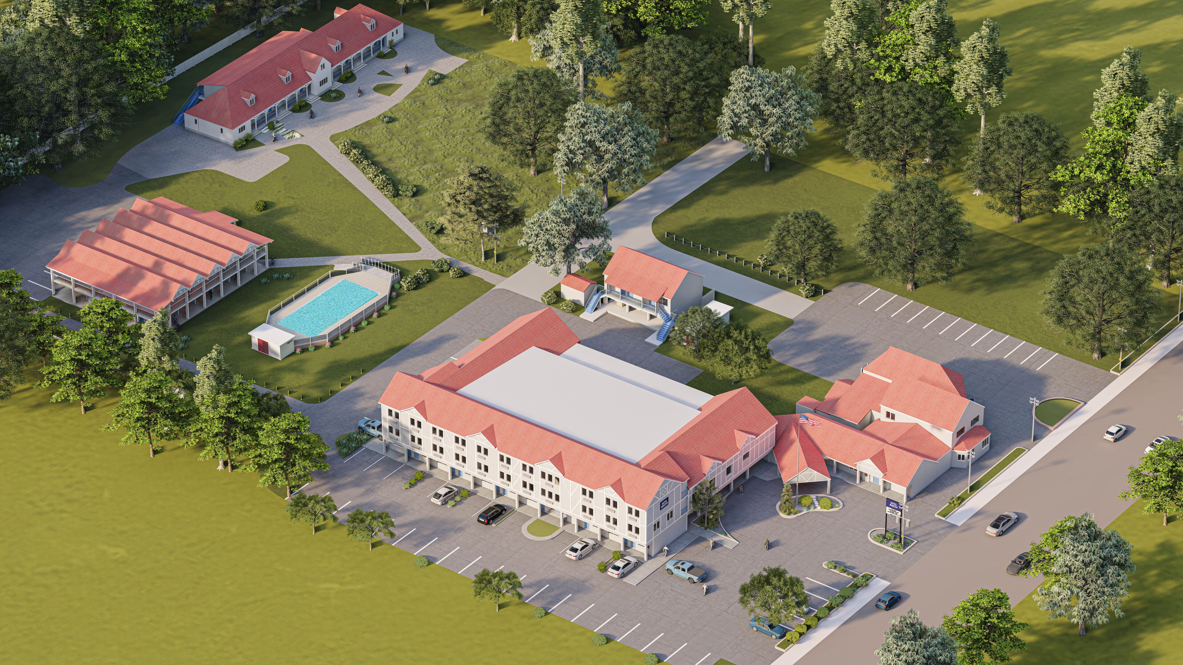 An aerial view of a hotel with multiple buildings, a swimming pool, and a parking lot.