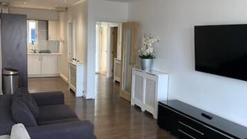 Apartamento, 1 cama King e sofá-cama | Área de estar