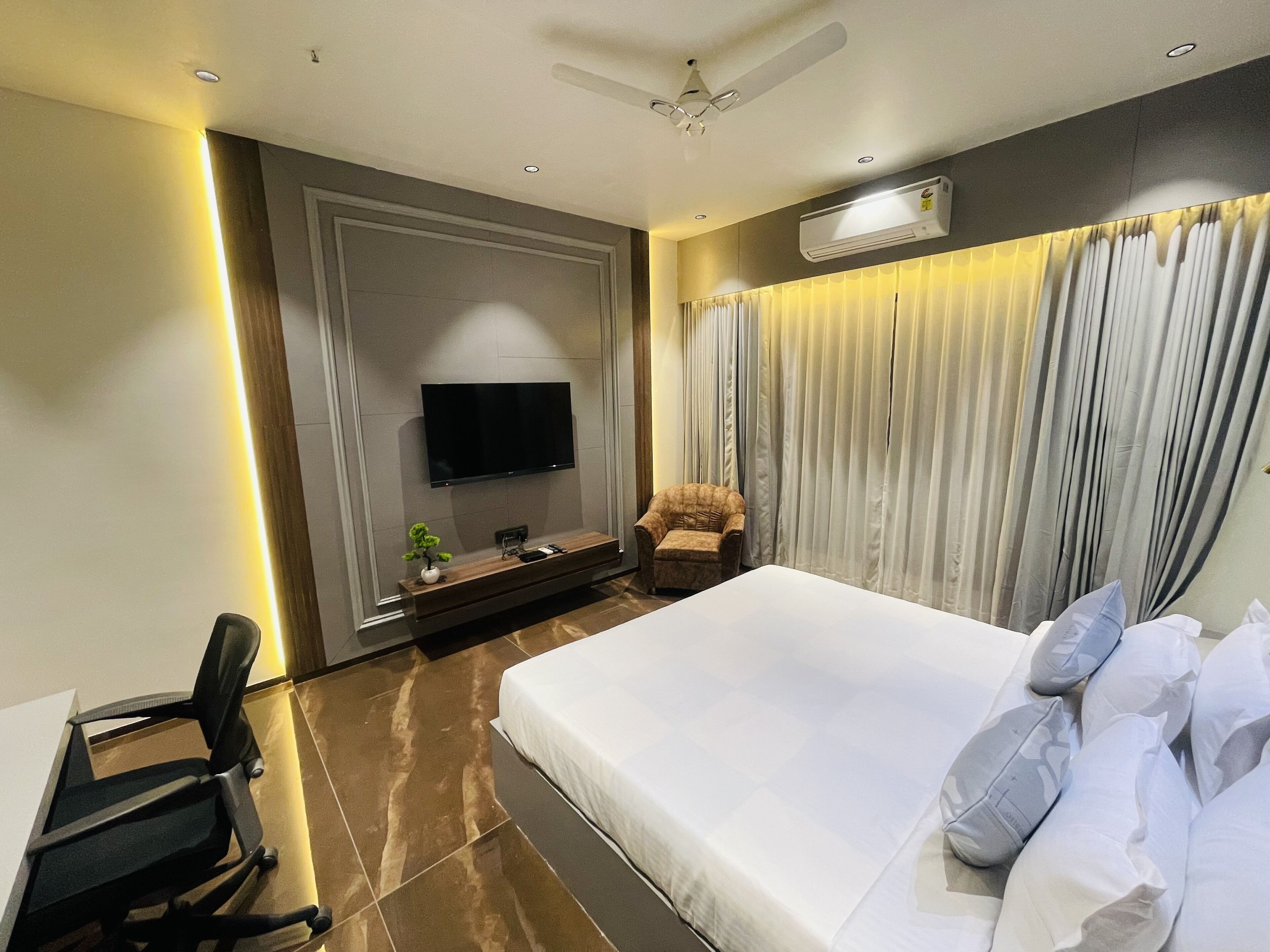 Premium bedding, desk, laptop workspace, soundproofing