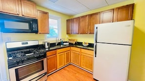 Fridge, coffee/tea maker, toaster, cookware/dishes/utensils