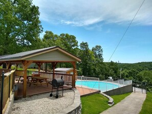 Outdoor dining - Gorgeous Branson Condo, VIEWS, Hike and Fish on Property, Private Lake, 2 Pools! (Reeds Spring)