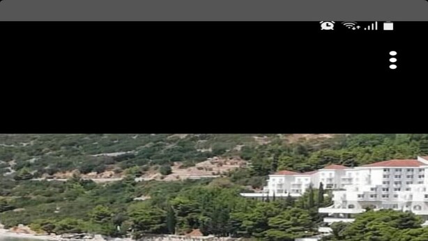 A coastal area with a beach, a pier, and buildings in the background. - Apartments Kamaki - Two Bedroom Apartment with Balcony and Sea View (Gradac)