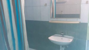 A bathroom with a shower, a sink, and a mirror. - Apartments Kamaki - Two Bedroom Apartment with Balcony and Sea View (Gradac)