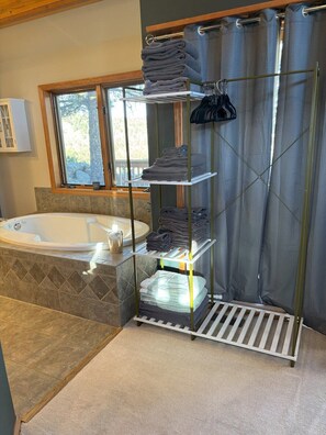 Jetted bath, towels, soap, toilet paper