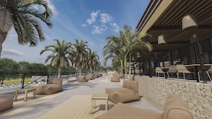 A modern outdoor lounge area with seating and palm trees, overlooking a pool. - Cook's Club Calvia Beach Adults Only +21 (Calvia)