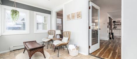 Enter through a comfortable enclosed porch