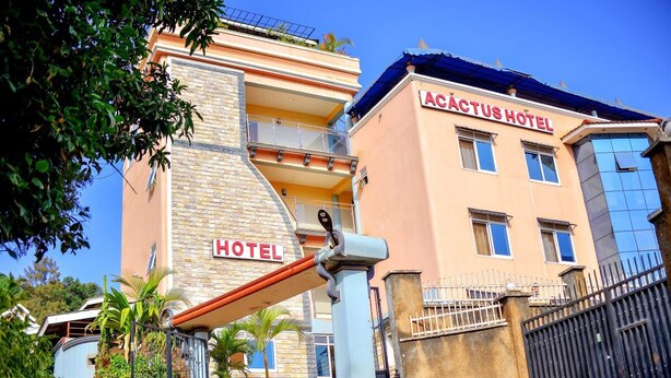 A hotel with a prominent sign reading "ACTUS HOTEL" and a visible entrance gate. - Acactus Hotel kampala  (Kampala)