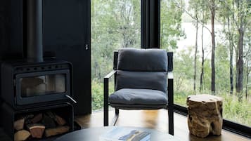 Joyce, One Bedroom, Off-Grid WanderPod | Living area | Fireplace, MP3 dock