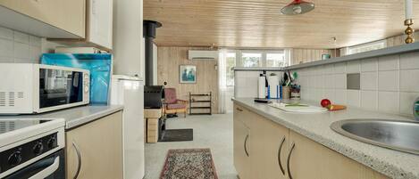 Fridge, stovetop, dishwasher, coffee/tea maker