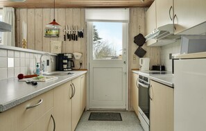 Fridge, stovetop, dishwasher, coffee/tea maker