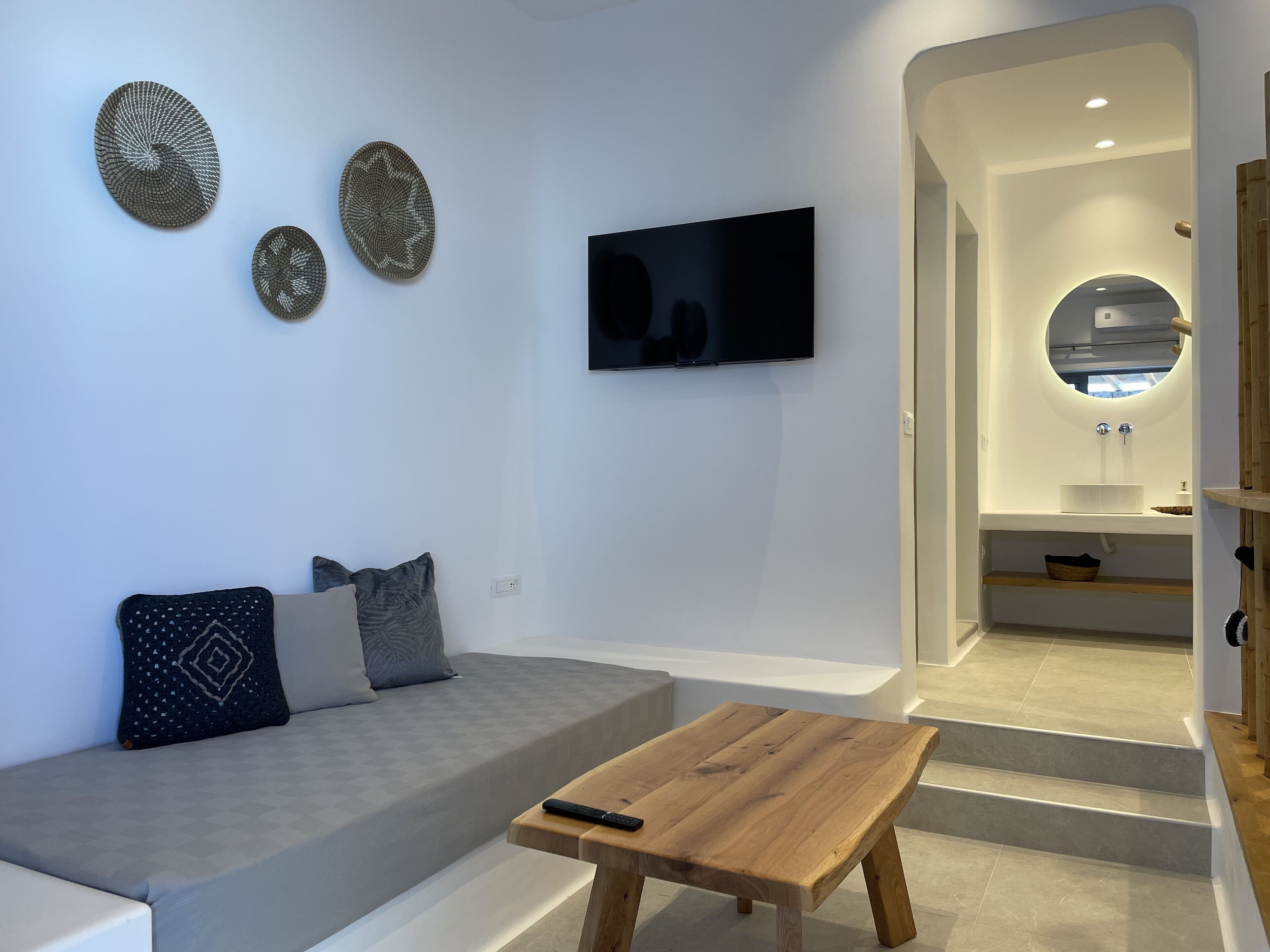 superior suite with side sea and pool view & outdoor hot tub | living area | 45-inch smart tv with satellite channels, tv