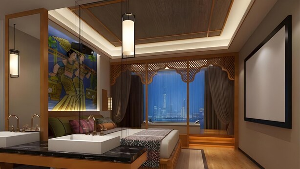 Un dormitorio moderno con una cama grande, un tocador con espejo y vistas a la ciudad.