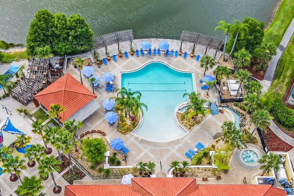 A heated pool - Relax & Recharge: Stylish Villa w/ Private Hot Tub (Osceola County)