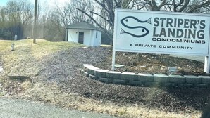 A sign for Striper's Landing, a private community with condominiums. -    LAST MINUTE VACATION?  JULY 20-JULY 22.  LOW RATES. (Moneta)