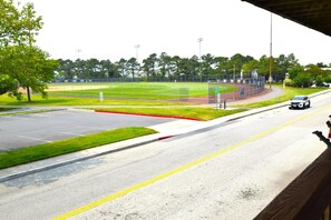 A parking lot with a sports field in the background. - Raffles 206 1 Bedroom Condo by RedAwning (Ocean City)