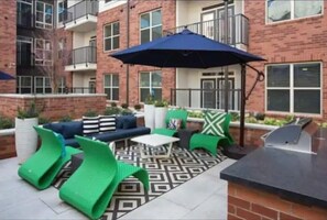 Relax on the patio with a barbecue grill and comfortable seating options.