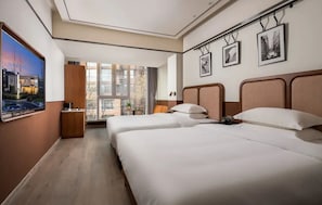 A hotel room with two beds, a large window, and a flat-screen TV. - A Memory Hotel (Beijing)