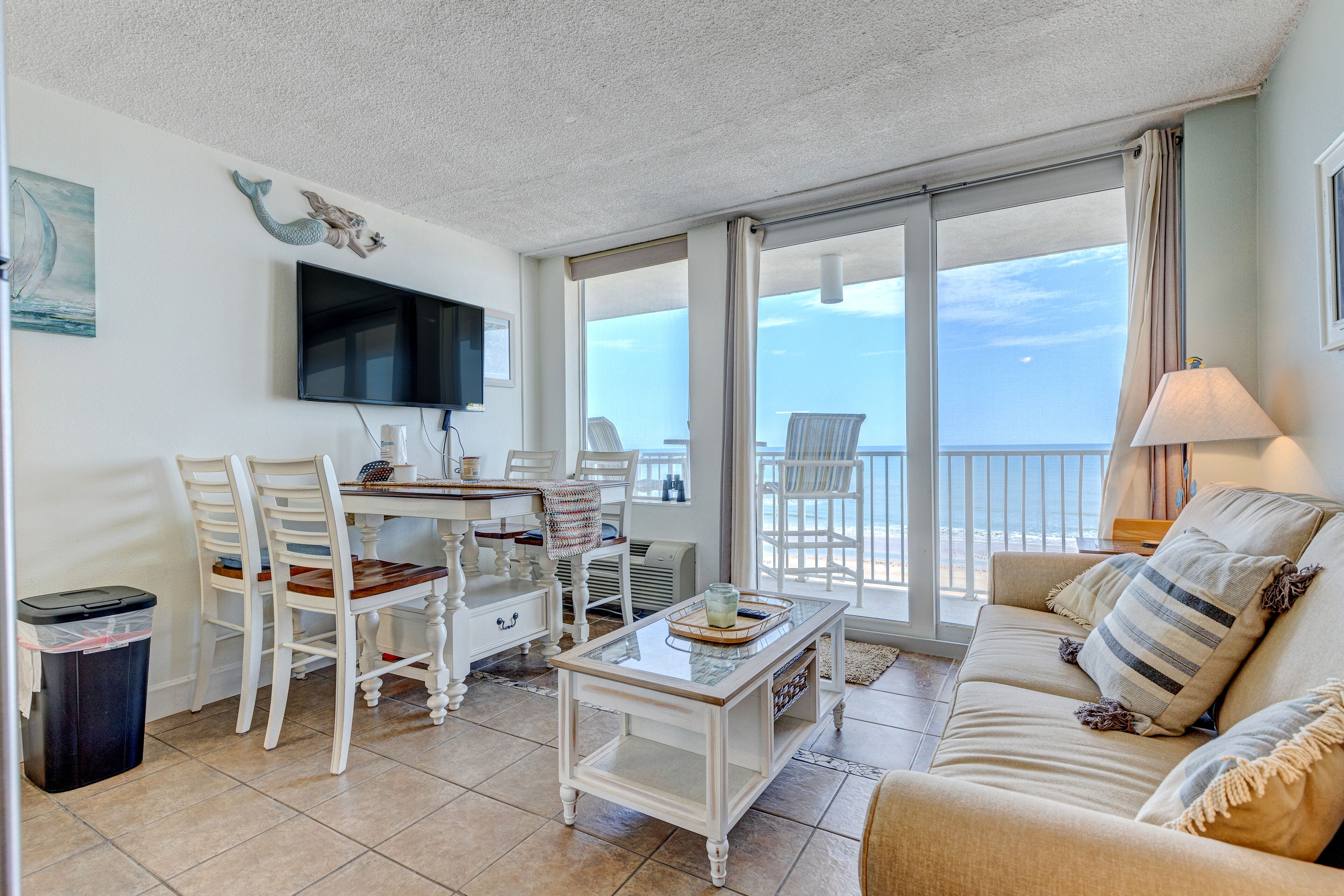 Beachfront condo with gulf-view balcony, pool, gym, & game room