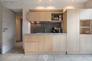 Fridge, microwave, stovetop, coffee/tea maker