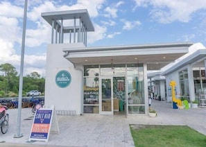 A building with a sign reading "Frankie's" and "Flamingo's in a flock of pigeons". - 2 Adult Bikes! Walk to Pool & Beach! Heart of Seagrove - Summer Breeze at Seagrove Beach 30A (Santa Rosa Beach)