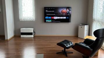 Comfort Villa | Living area | 60-inch flat-screen TV with digital channels, TV