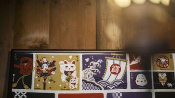 A wooden surface with a framed collection of Japanese artwork.