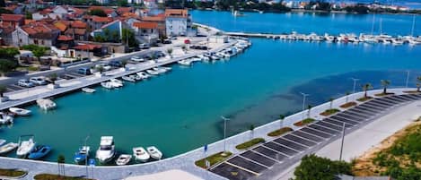 Enjoy stunning views of the surrounding town from this marina with a parking area and docked boats.
