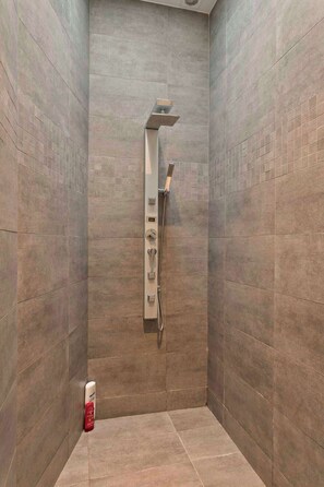 Shower, hair dryer, towels, shampoo