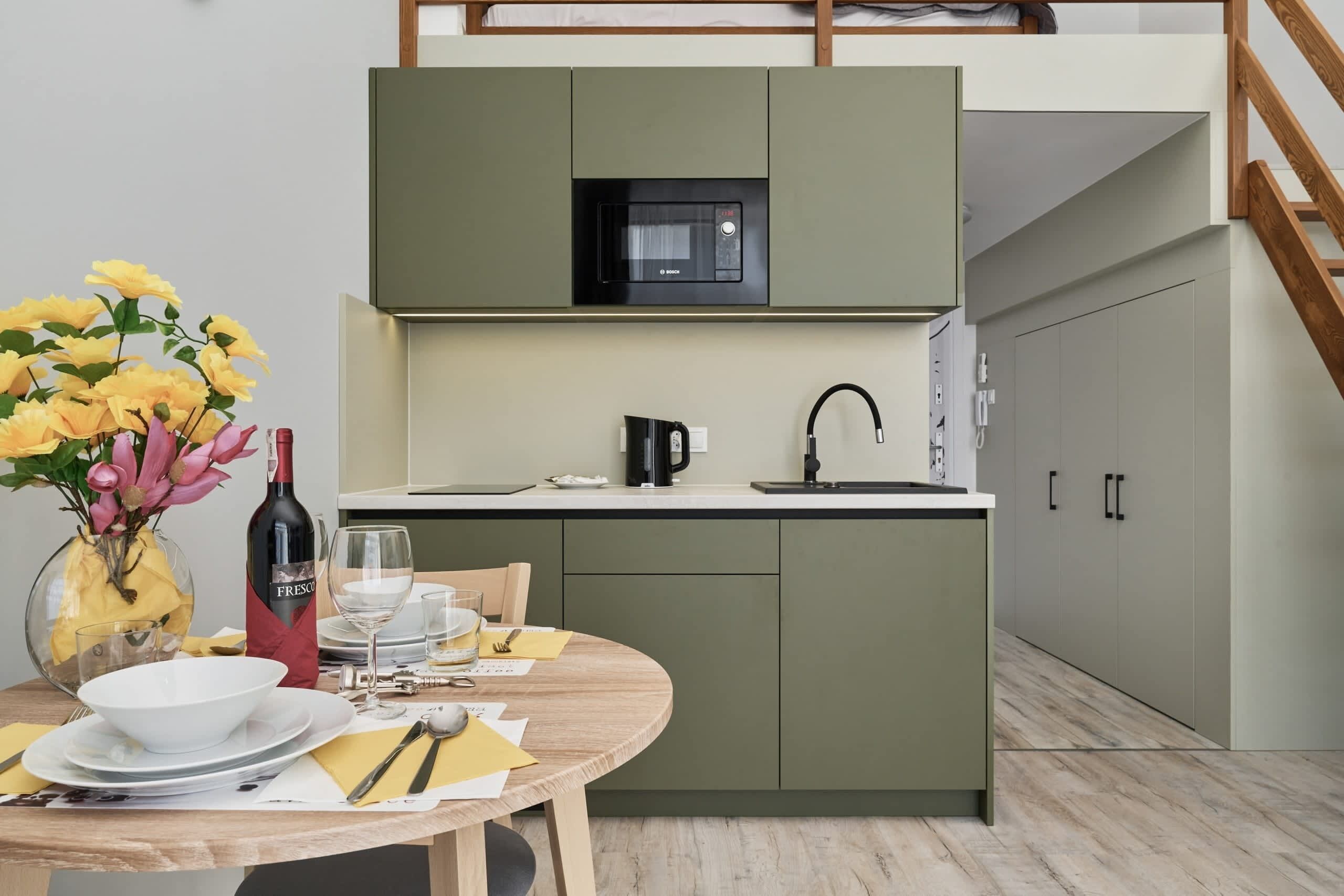 Fridge, stovetop, electric kettle, cookware/dishes/utensils
