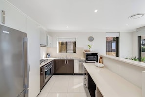 Fridge, microwave, oven, stovetop - Amelie - Luxury, Beach View 3 Bedroom Condo - 2 min walk to Terrigal Beach (Terrigal)