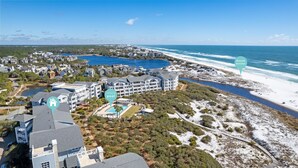A coastal resort with a community pool, beachfront access, and a view of the ocean. - PANORAMIC GULF FRONT in WATERSOUND BRIDGES! VIEWS, OUTDOOR BALCONY, 30A Area (Watersound)
