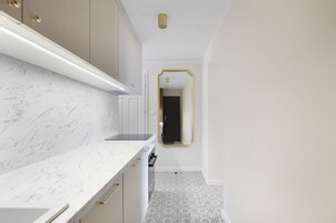 Deluxe Apartment | Living area | Flat-screen TV