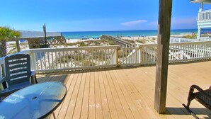 A wooden deck with a view of the beach and ocean. - Beachfront - Great Location! (Gulf Shores)