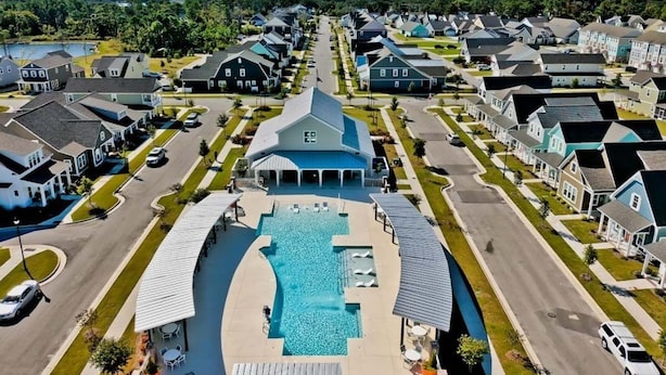 A residential area with a swimming pool and houses.