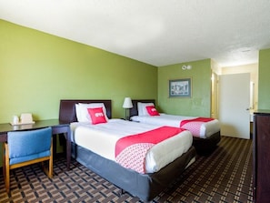 A hotel room with two beds, a desk, and a chair. - OYO Hotel Pensacola I-10 & Hwy 29 (Pensacola)