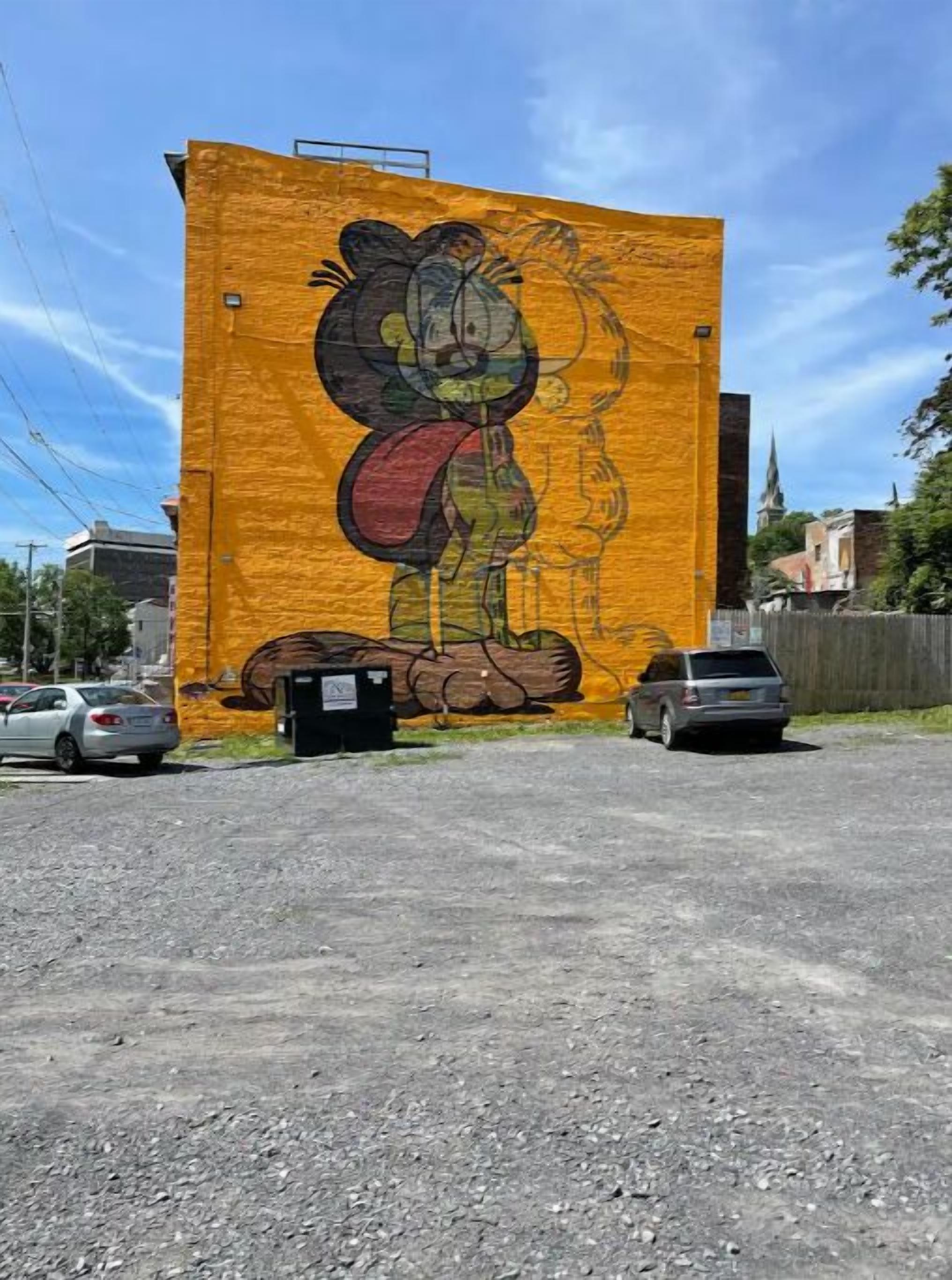 A large mural of a cartoon character on a building.