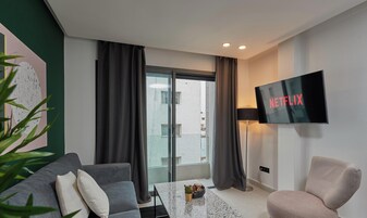 Royal Apartment | Living area | 46-inch Smart TV with cable channels, TV