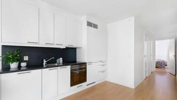 Departamento | Cocina privada | Refrigerador, horno, parrilla de estufa y lavavajillas