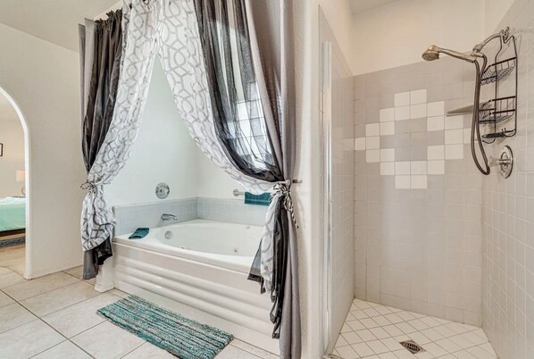Shower, jetted tub, towels, soap