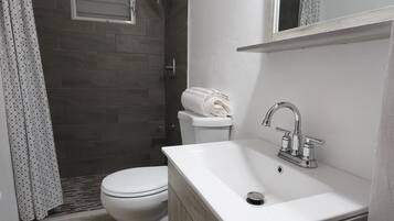 Shower, towels, soap, toilet paper