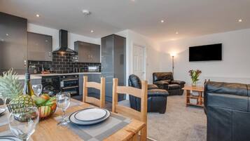 Desk, iron/ironing board, bed sheets