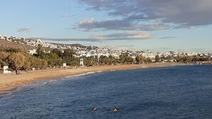 A coastal town with a beach, houses, and a clear sky. - Apartment 120m2 between sea and mountains in Glyfada, Athens Riviera (Glifada)