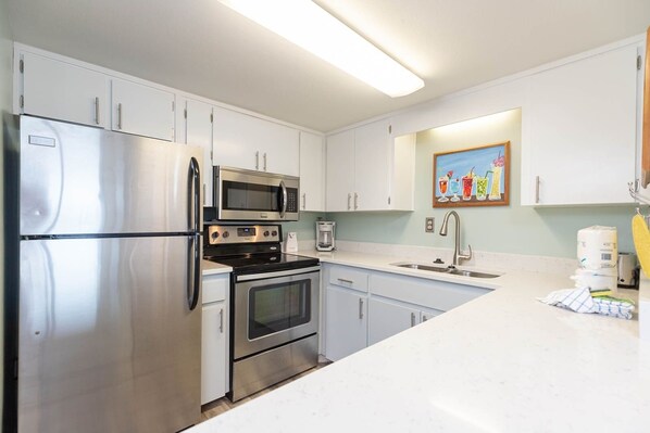 Condo, 2 Bedrooms | Private kitchen | Fridge, oven, coffee/tea maker