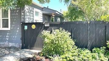 A residential property with a gated entrance, a mailbox, and a number 1504 on the gate.