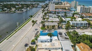 A coastal cityscape with a marina, wide roads, and residential buildings. - Charming Studio Walking Distance To Ocean - Unit 8 (Hollywood)