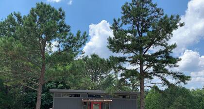 The Ridge Adventure Center rustic pet friendly tiny cabin, outdoor shower stage