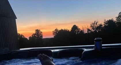 The Adventure Center rustic tiny cabin hot tub access stage stars sunsets & pets